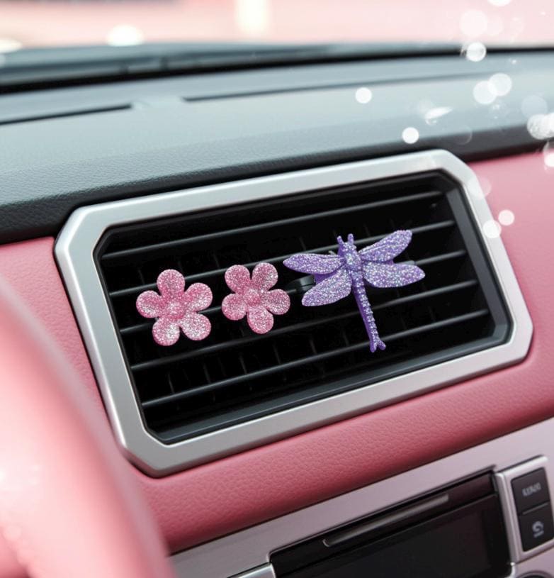 Car decor with floral and dragonfly designs on a car vent.