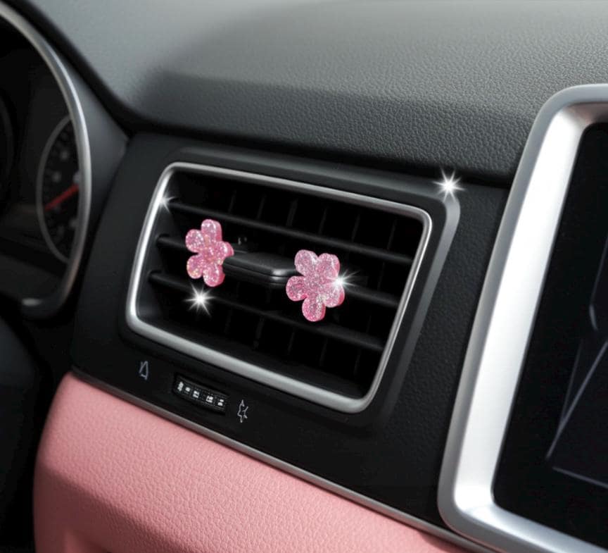 Pink flower-shaped car decor on a car dashboard
