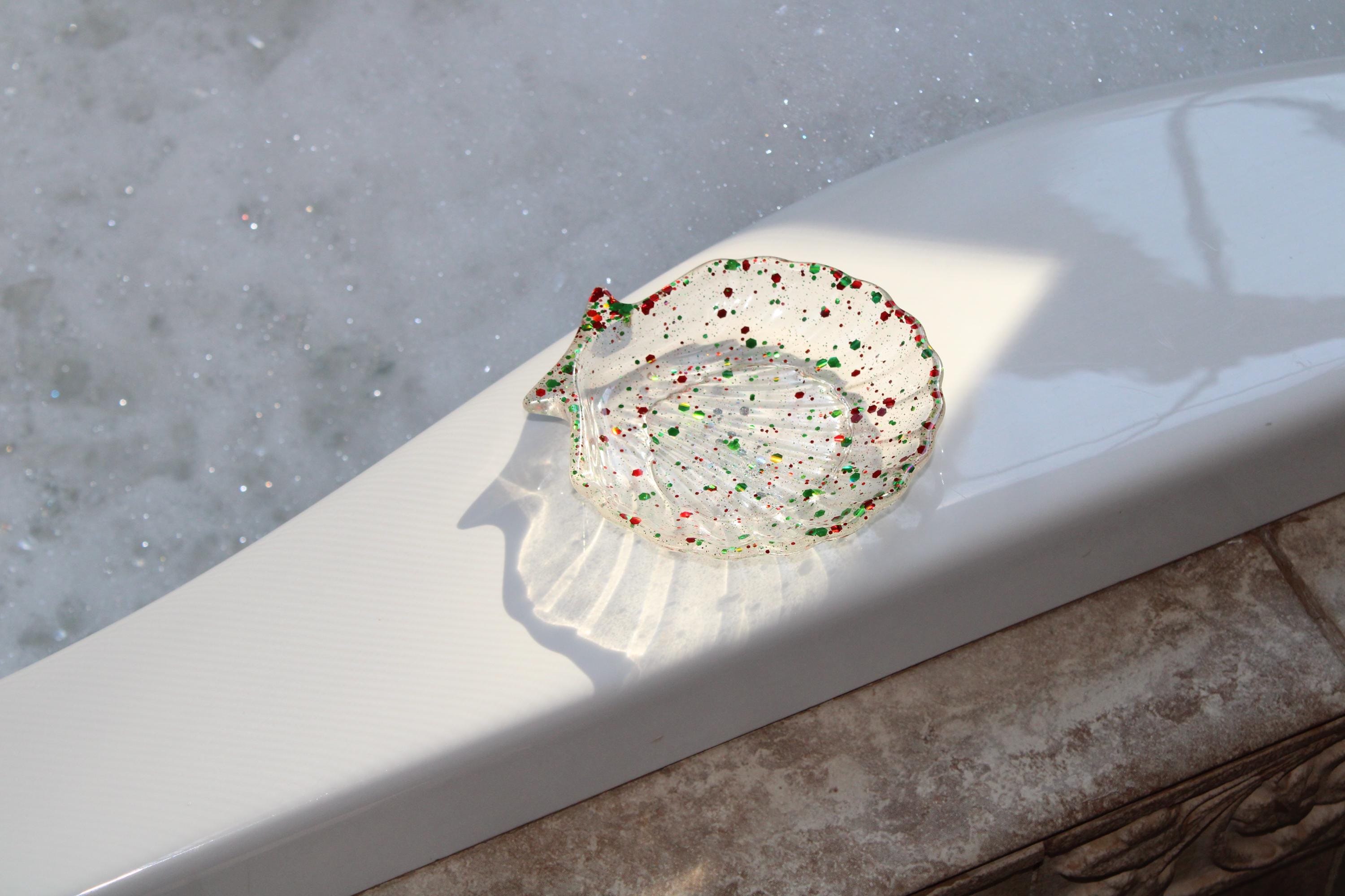 Seashell soap dish on the edge of a tub