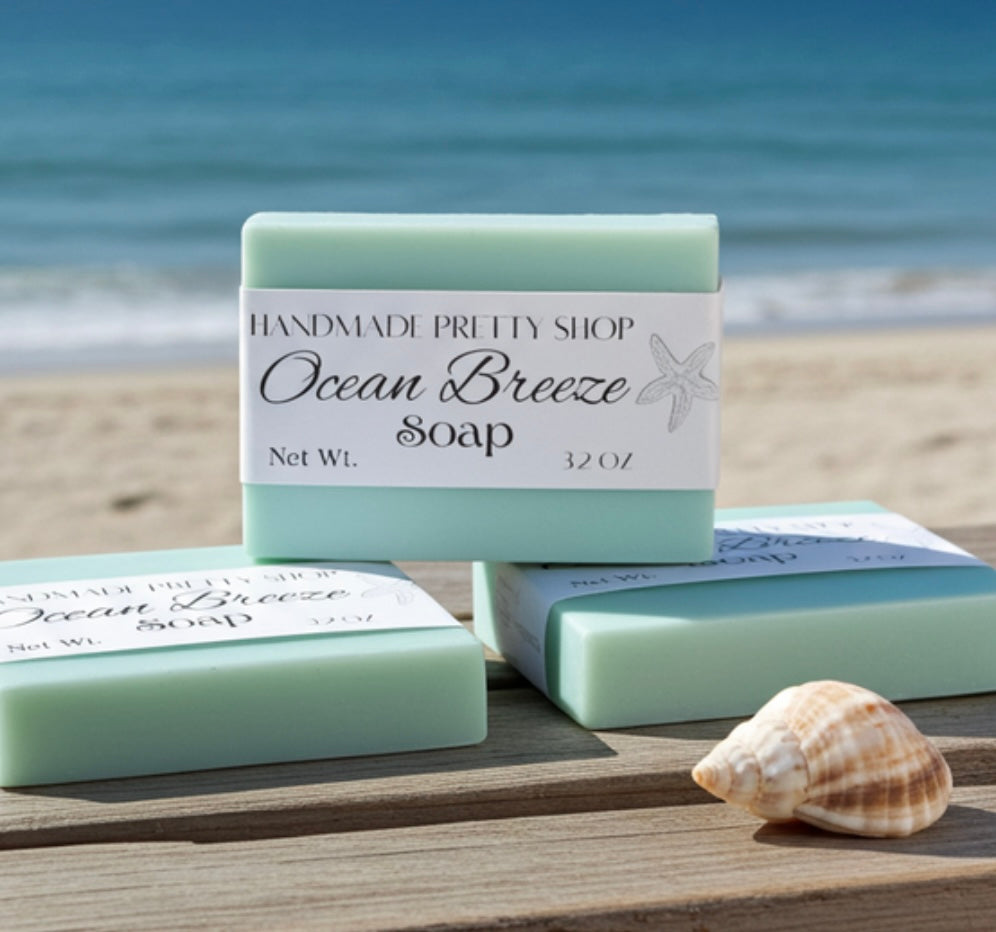 Ocean Breeze soap bars with a shell on a beach setting