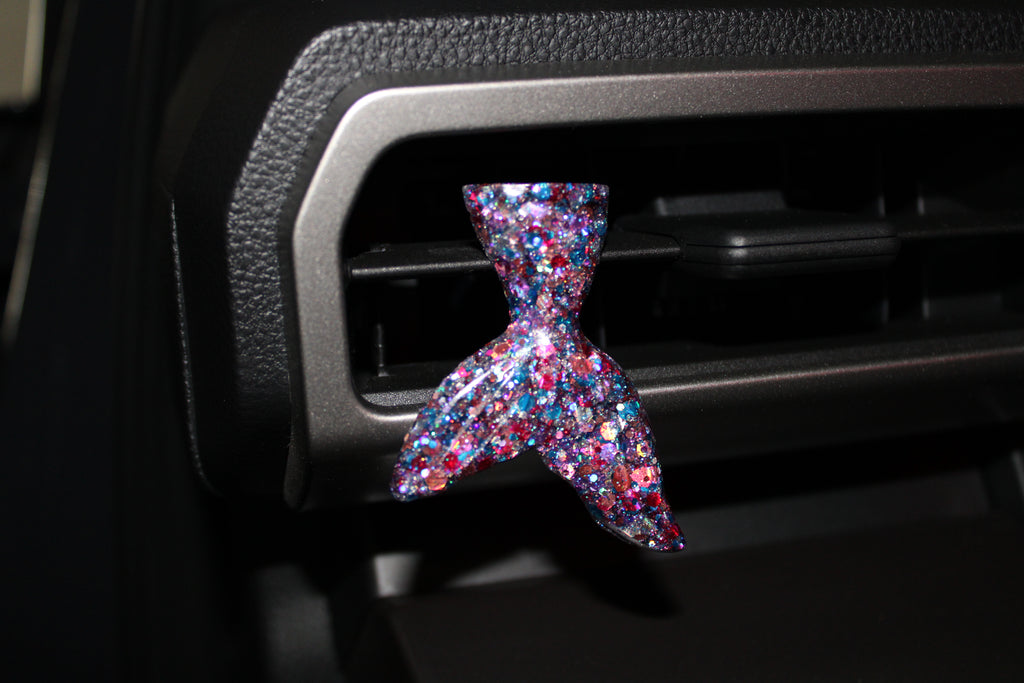 Multicolored glittery mermaid tail car vent clip on a cars air vent 