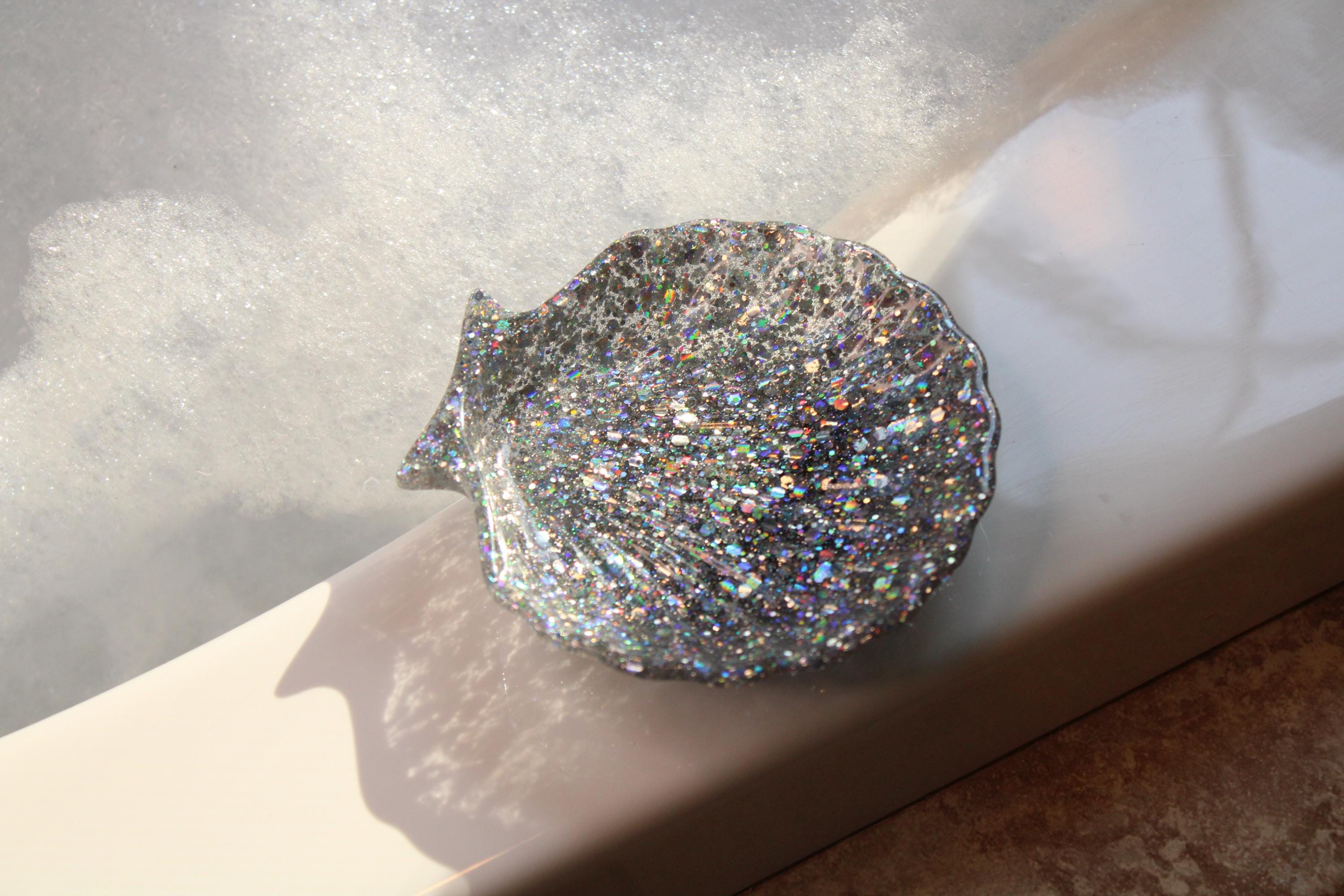 Sparkly silver shell dish on a light surface