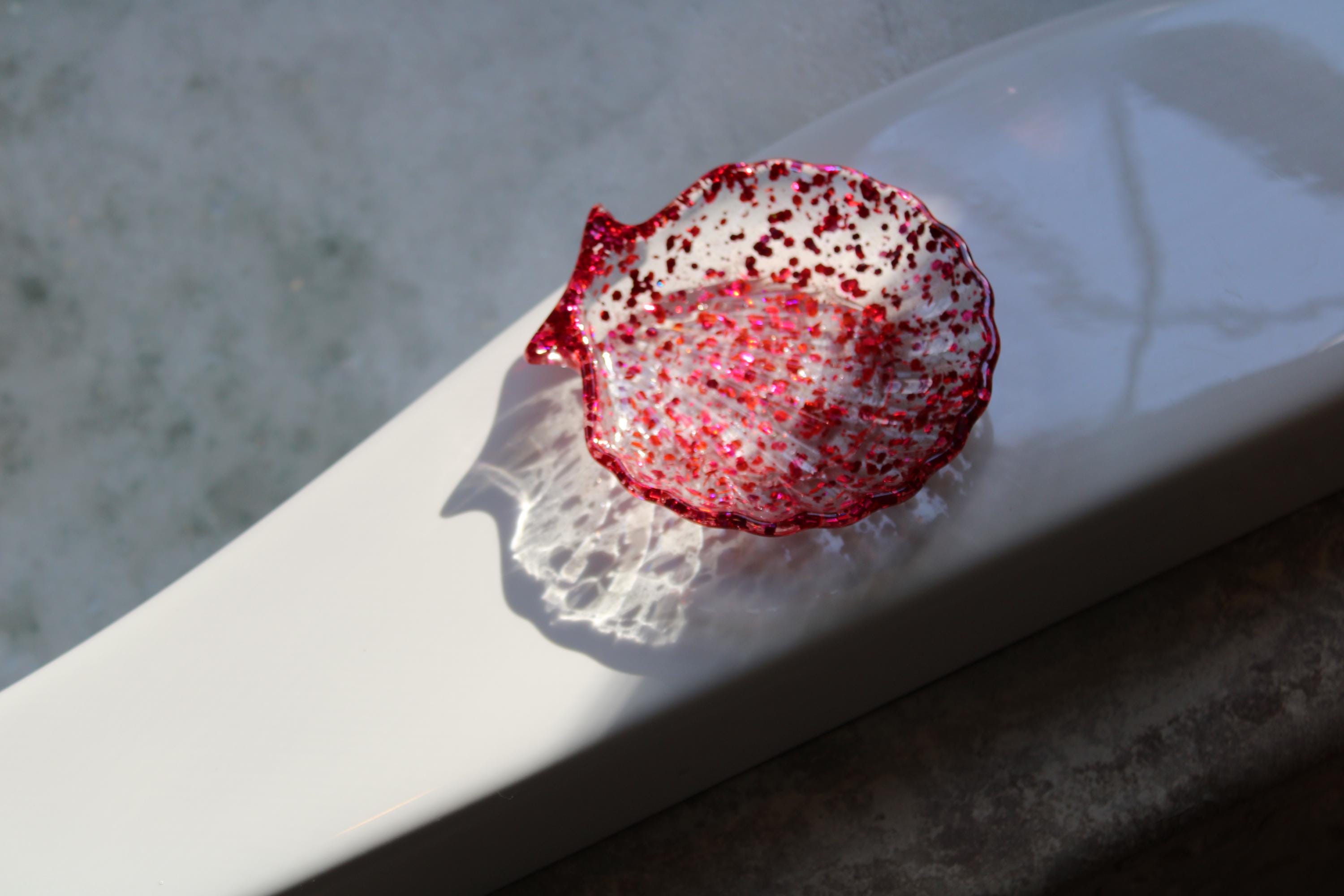 Rose pink sequin seashell soap dish on a tub