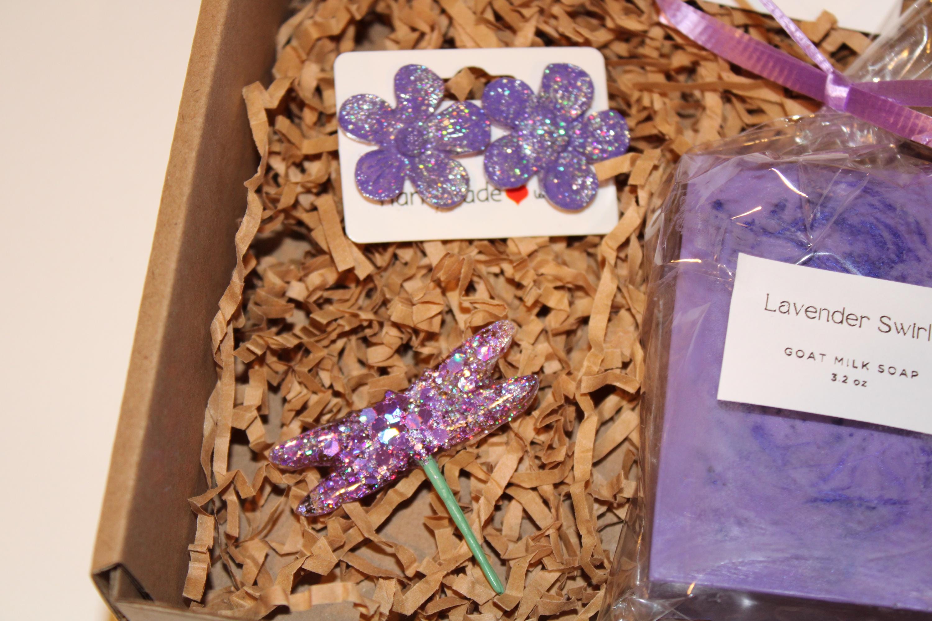 Box with lavender-themed items including a soap bar and decorative elements.