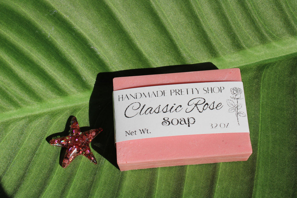 Bar of soap with a label on a green leaf background