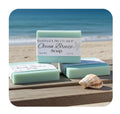 Ocean Breeze soap bars with a shell on a beach setting