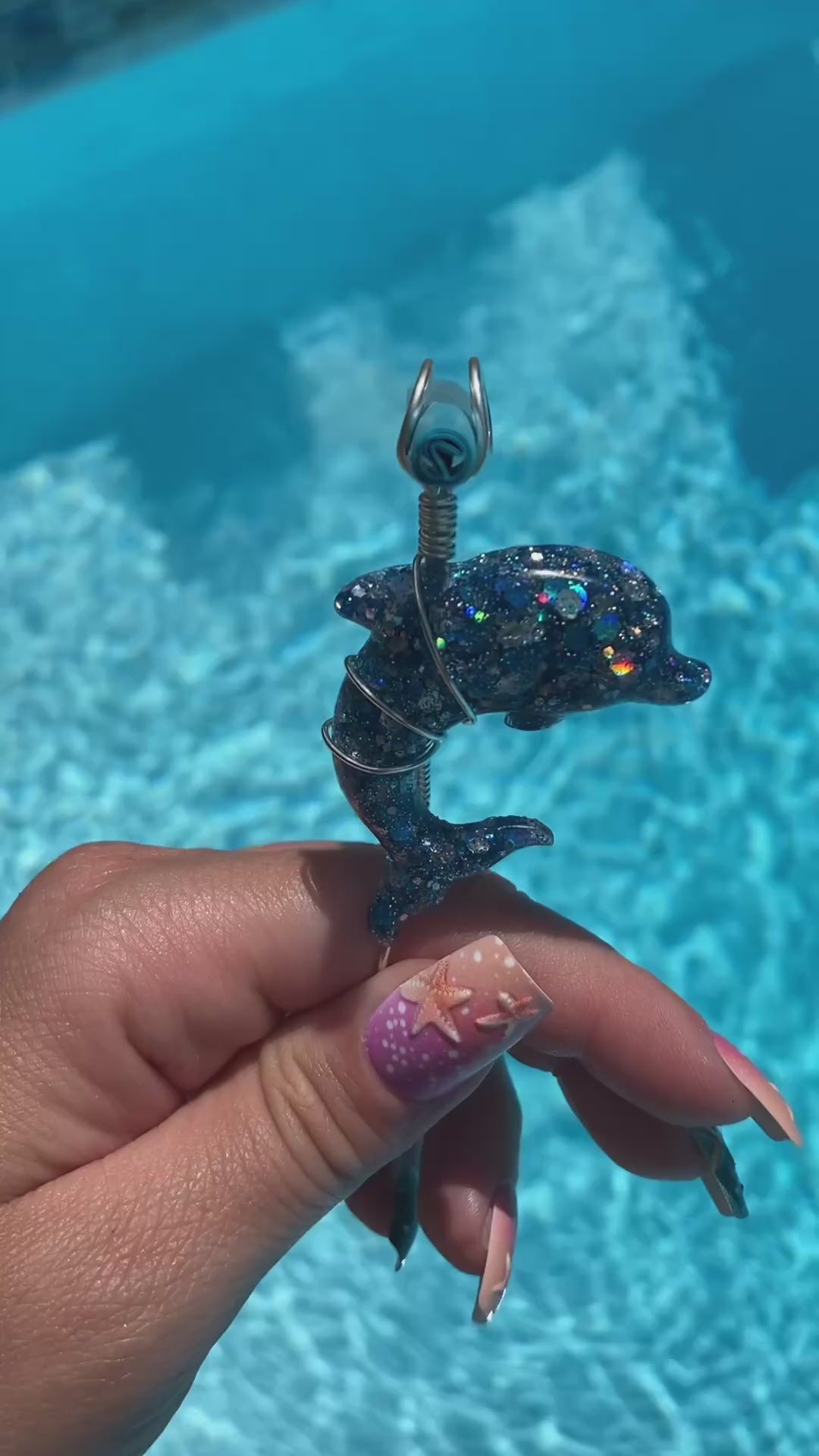 Video shows a blue sequin dolphin smoke ring lit with a faux joint 