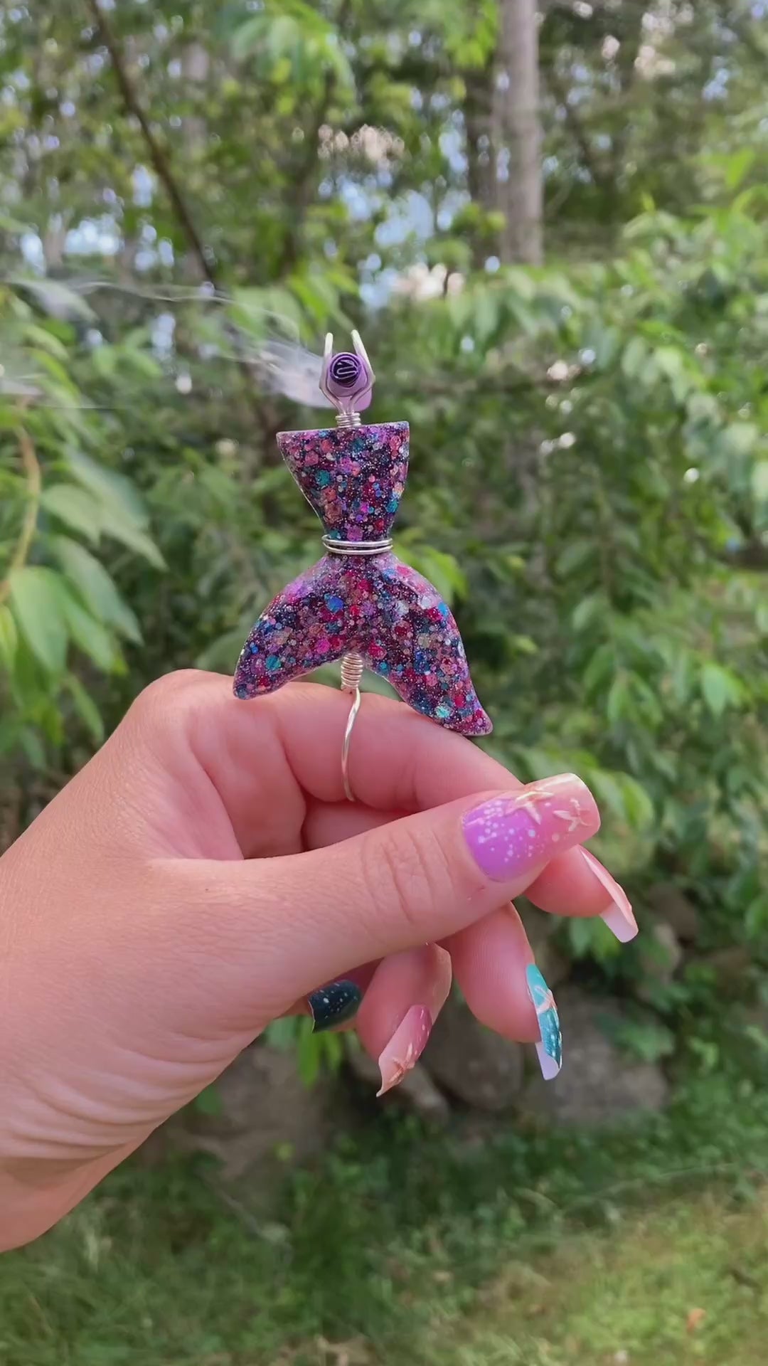 Video shows a mermaid tail smoke ring lit with a faux joint