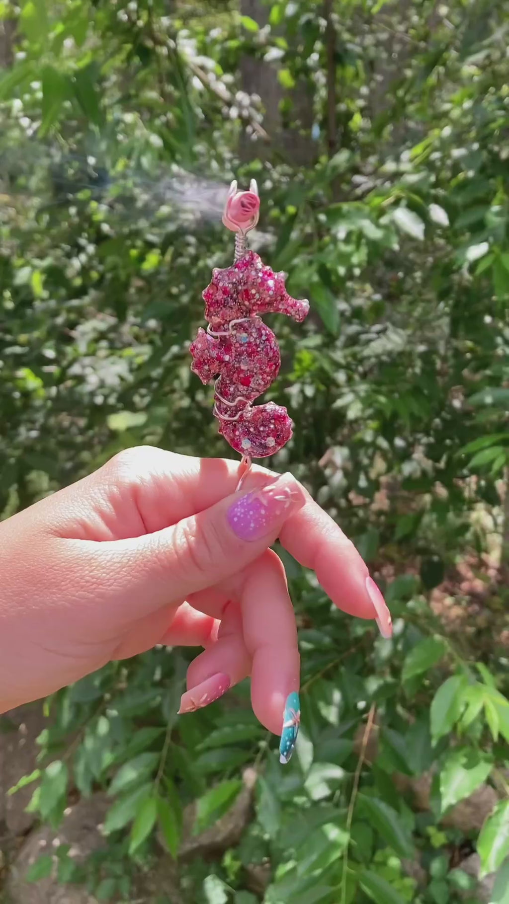 Video shows a pink sequin seahorse smoke ring lit with a faux joint 
