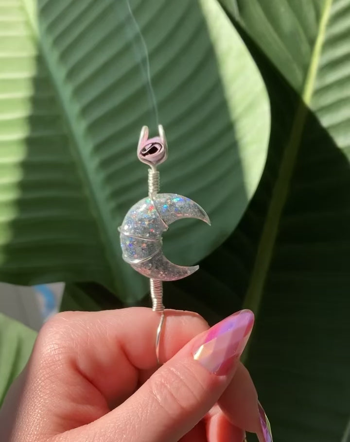 Crescent moon smoke ring lit with a faux joint.