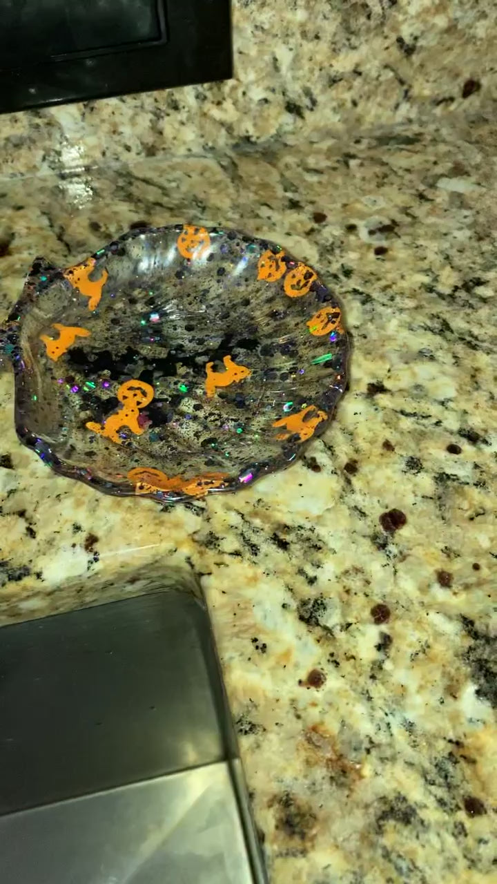 The video shows a Halloween themed seashell soap dish on a counter top.