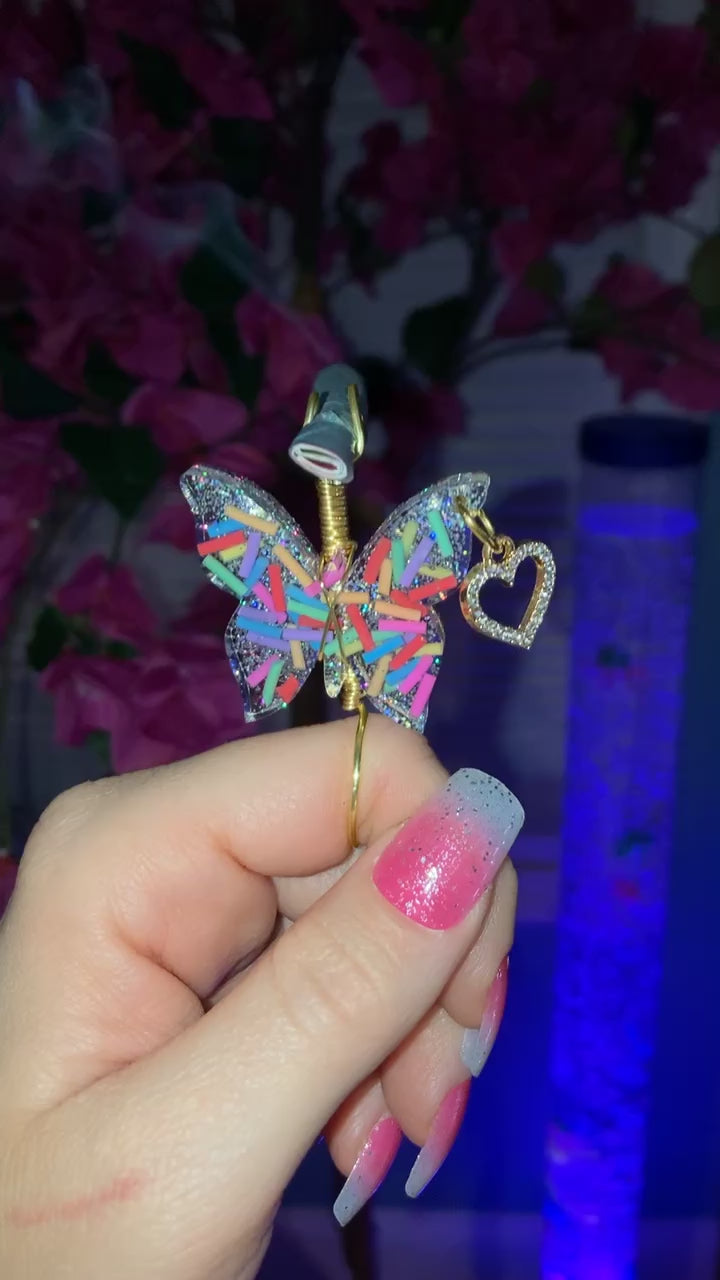 Video shows a butterfly sprinkle design smoke ring lit with a faux joint